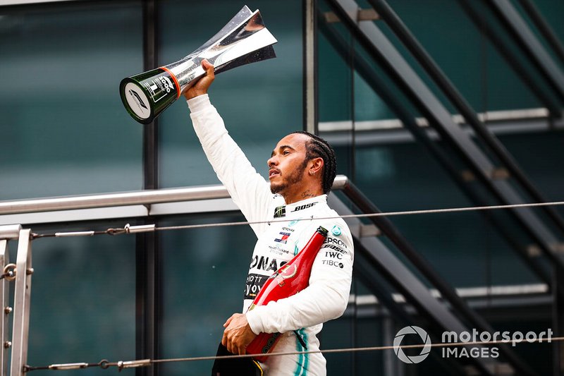 Lewis Hamilton, Mercedes AMG F1, 1st position, with his trophy on the podium