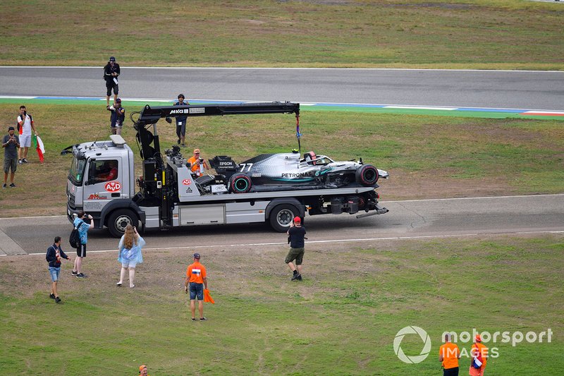 Fans invade the circuit after the race as marshals remove the car of Valtteri Bottas, Mercedes AMG W10