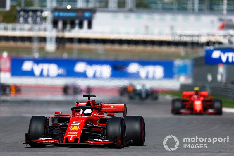 Sebastian Vettel, Ferrari SF90, leads Charles Leclerc, Ferrari SF90