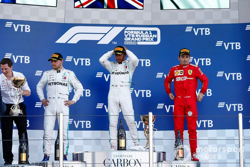 Fred Judd, Chief Engineer Trackside, Mercedes AMG F1, Valtteri Bottas, Mercedes AMG F1, 2nd position, Lewis Hamilton, Mercedes AMG F1, 1st position, and Charles Leclerc, Ferrari, 3rd position, on the podium