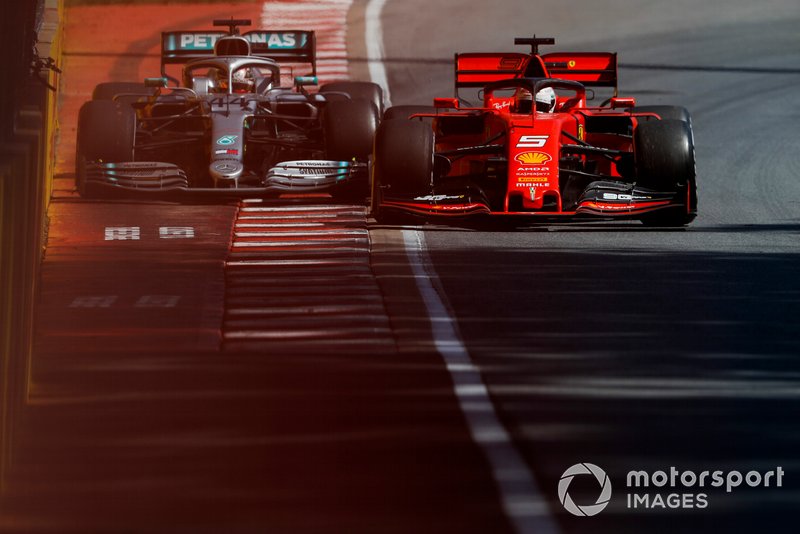Sebastian Vettel, Ferrari SF90 and Lewis Hamilton, Mercedes AMG F1 W10 battle 