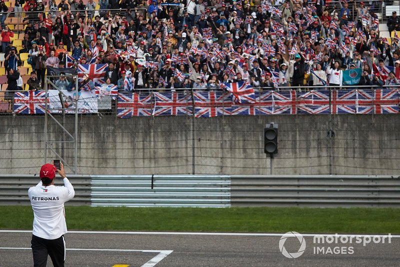 Race winner Lewis Hamilton, Mercedes AMG F1, takes a photo of his supporters