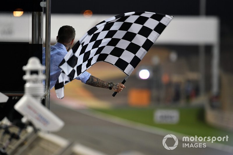 David Beckham waves the chequered flag