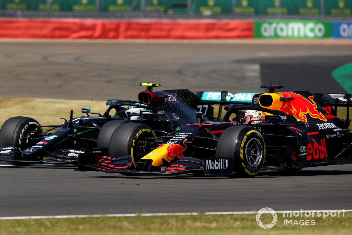 Valtteri Bottas, Mercedes F1 W11 and Max Verstappen, Red Bull Racing RB16 battle for the lead of the race
