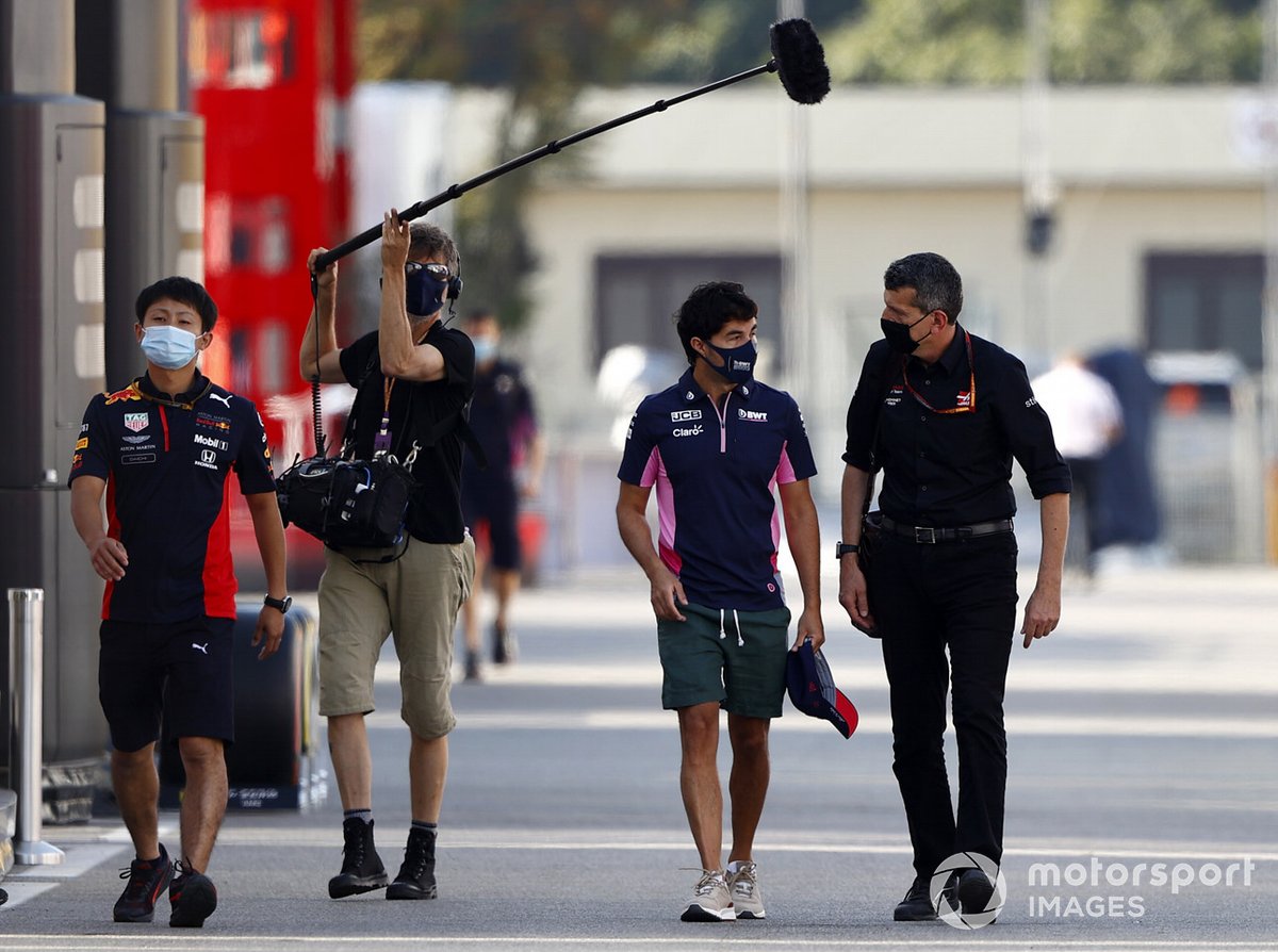 Sergio Perez, Racing Point speaks with Guenther Steiner, Team Principal, Haas F1 