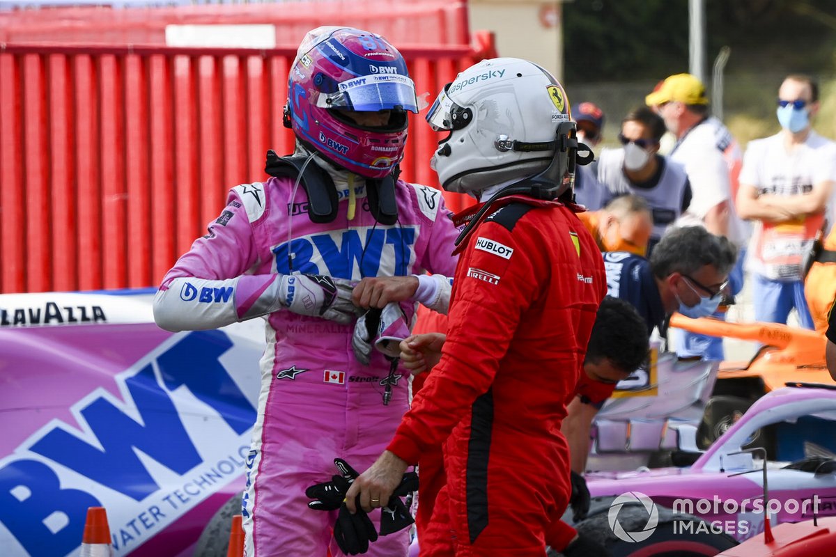 Lance Stroll, Racing Point, an Sebastian Vettel, Ferrari, talk in Parc Ferme after the race