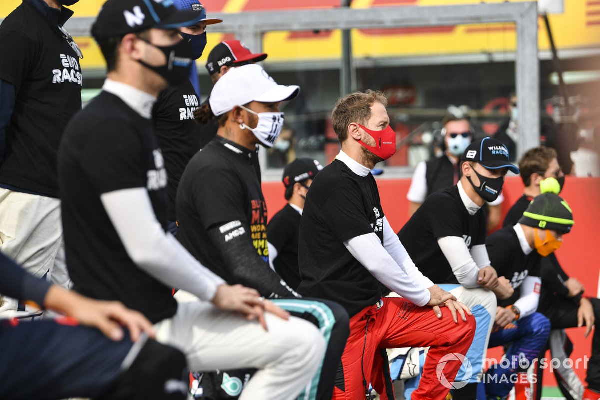 Lewis Hamilton, Mercedes-AMG F1, Sebastian Vettel, Ferrari, George Russell, Williams Racing, and the other drivers stand and kneel in support of the End Racism campaign prior to the start