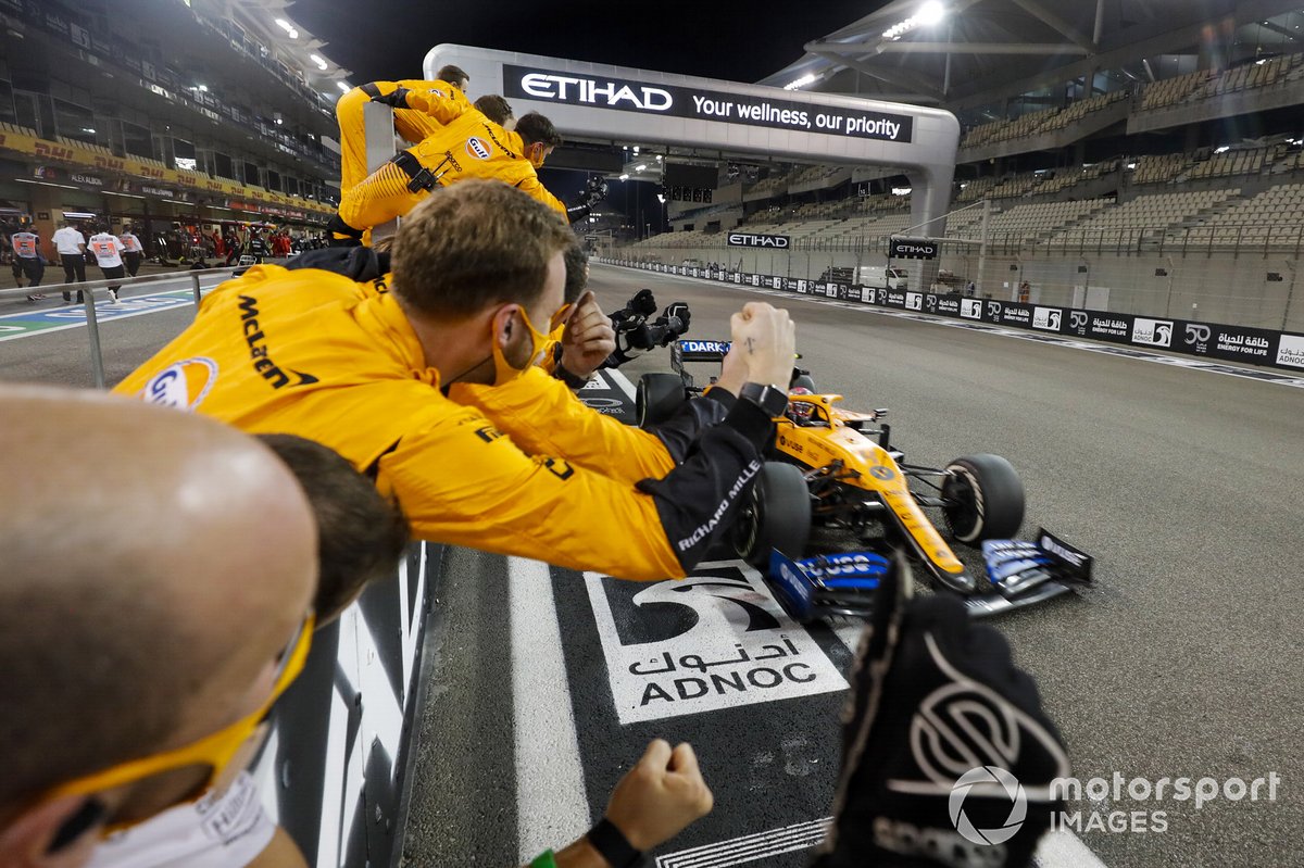 Lando Norris, McLaren MCL35 crosses the line to take te checkered flag