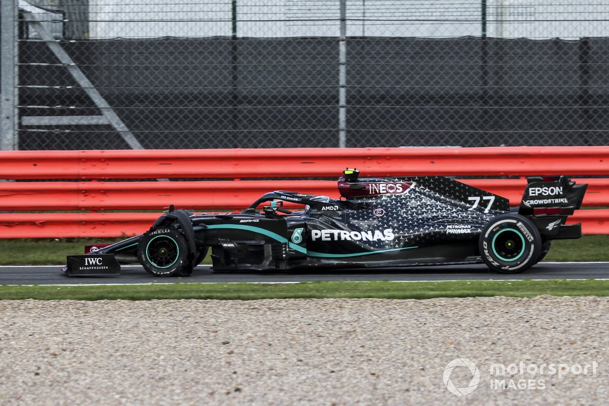 Valtteri Bottas, Mercedes F1 W11 coming into pit with a puncture